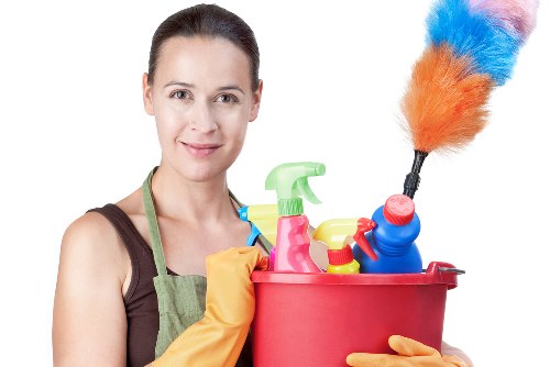 Cleaner using safety equipment during a professional cleaning task